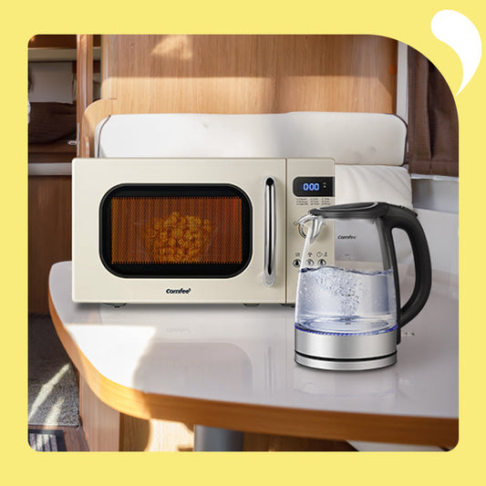 microwave oven and electric kettle on the table