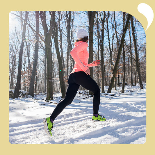 a woman is running in the winter
