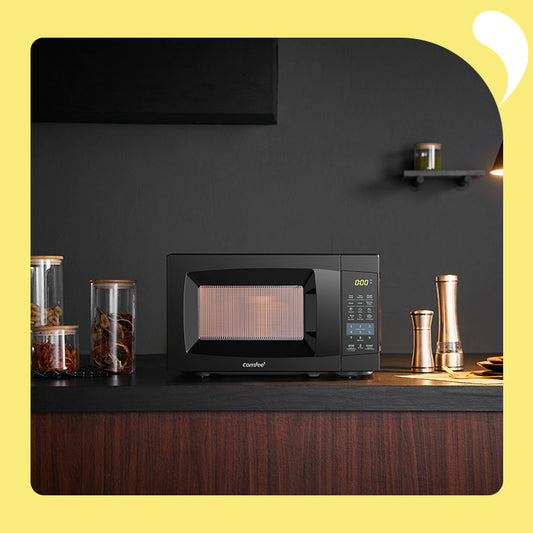 black comfee microwave oven on wooden countertop