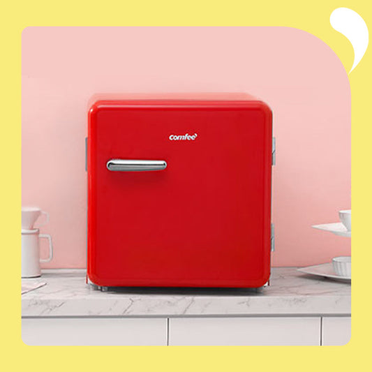 red retro fridge on the table