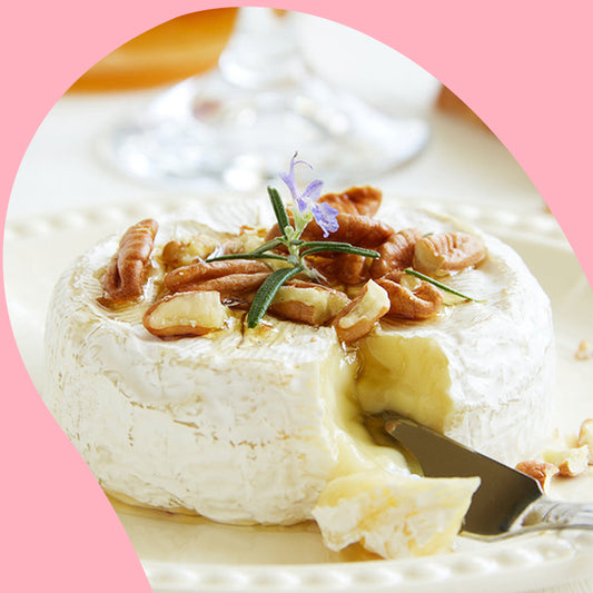 baked brie on a disposable paper plate