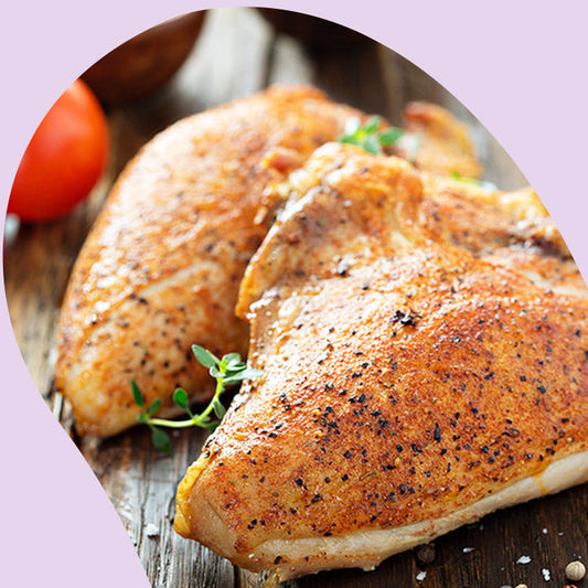 baked chicken breast on a wooden board