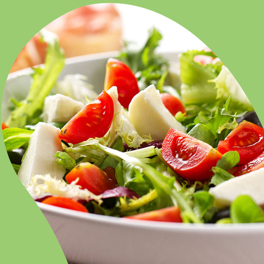 spring mixed salad in a white bowl