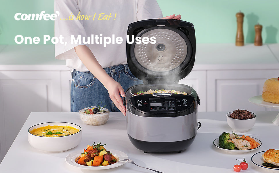 A woman is opening the lid of the rice cooker