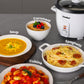 comfee mini rice cooker with rice inside surrounded by various meals