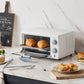 comfee toaster oven behind a plate of food and cutlery