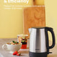 a bowl of rice and strawberries next to a kettle