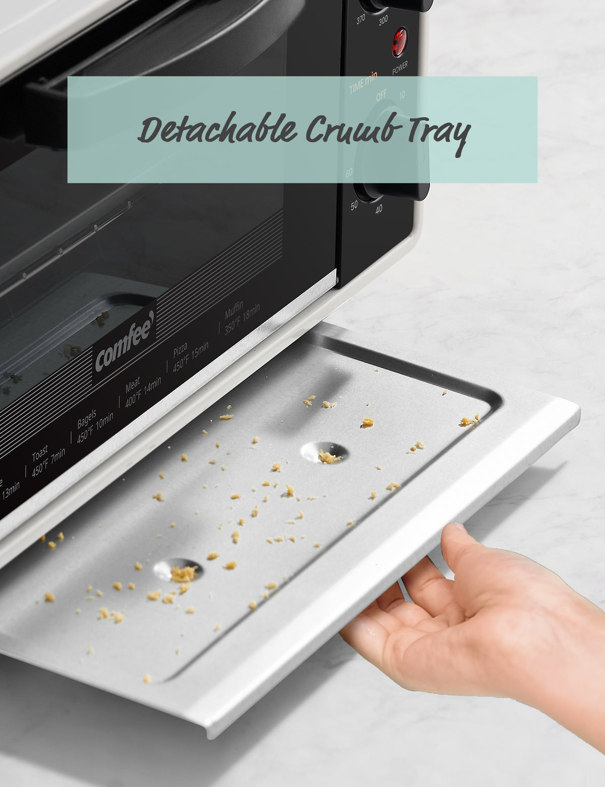 One hand pulled away the oven chassis, there are some crumbs on it