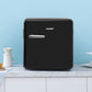 black comfee mini refrigerator on a countertop next to donut and cup