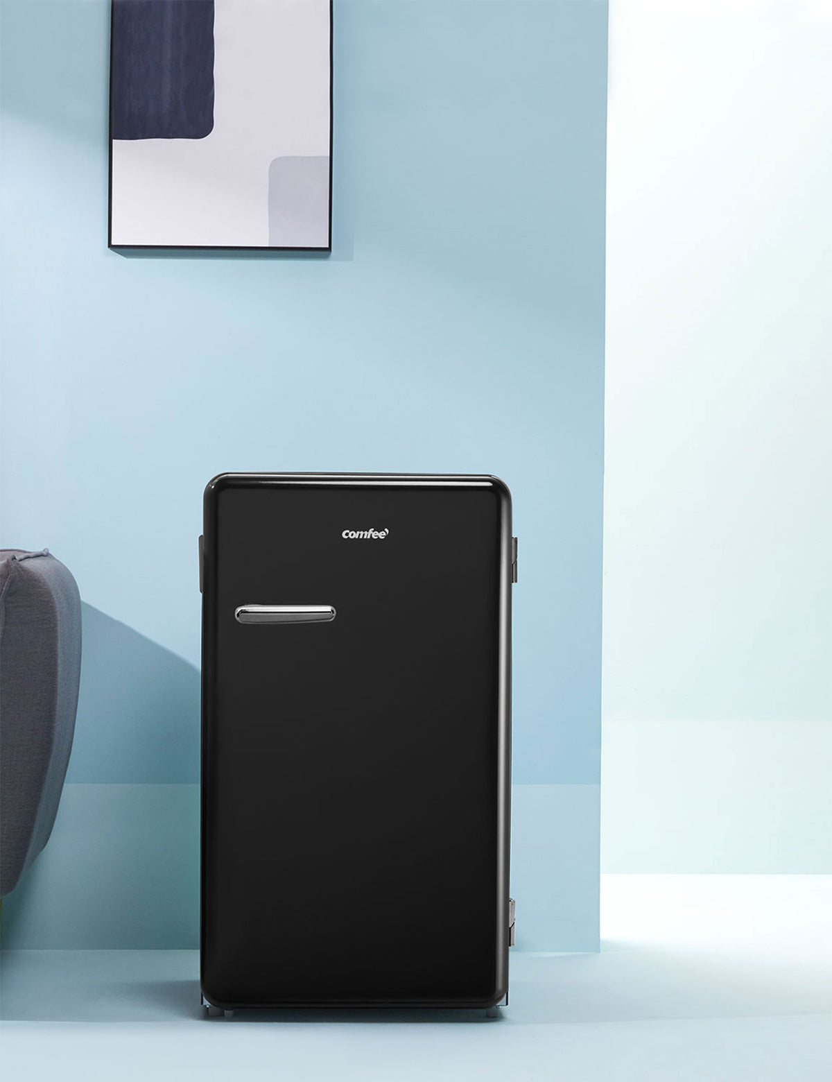 black comfee fridge in a blue modern interior