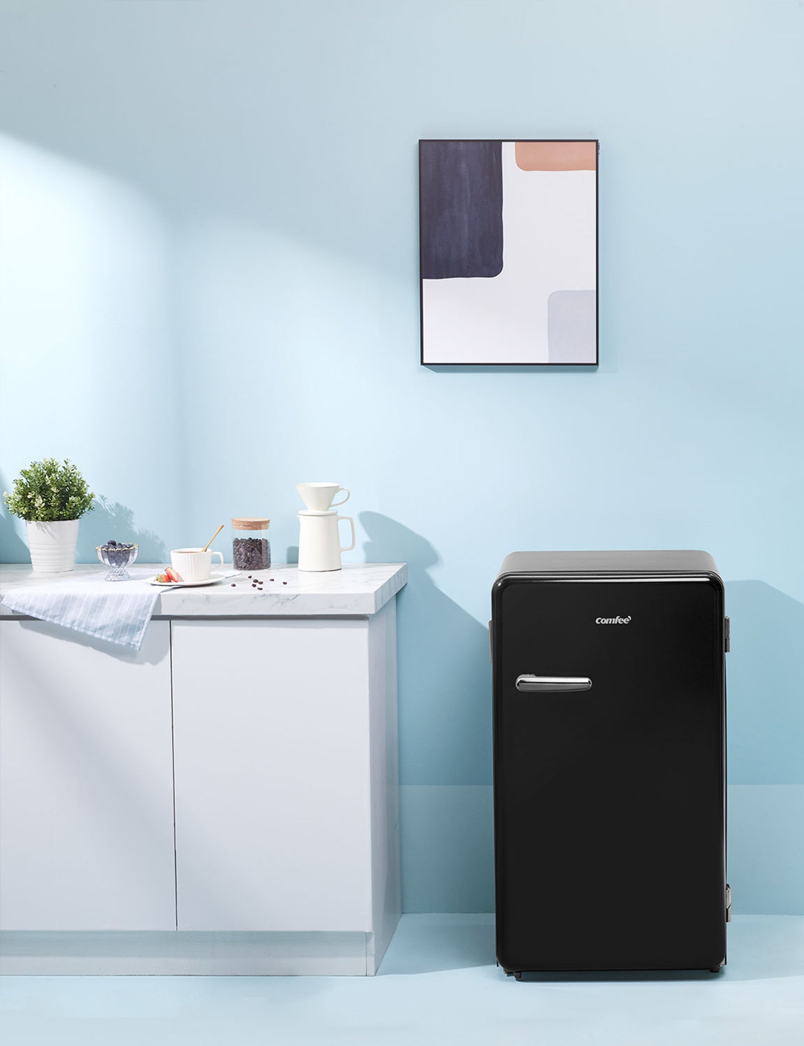black compact refrigerator in a modern interior