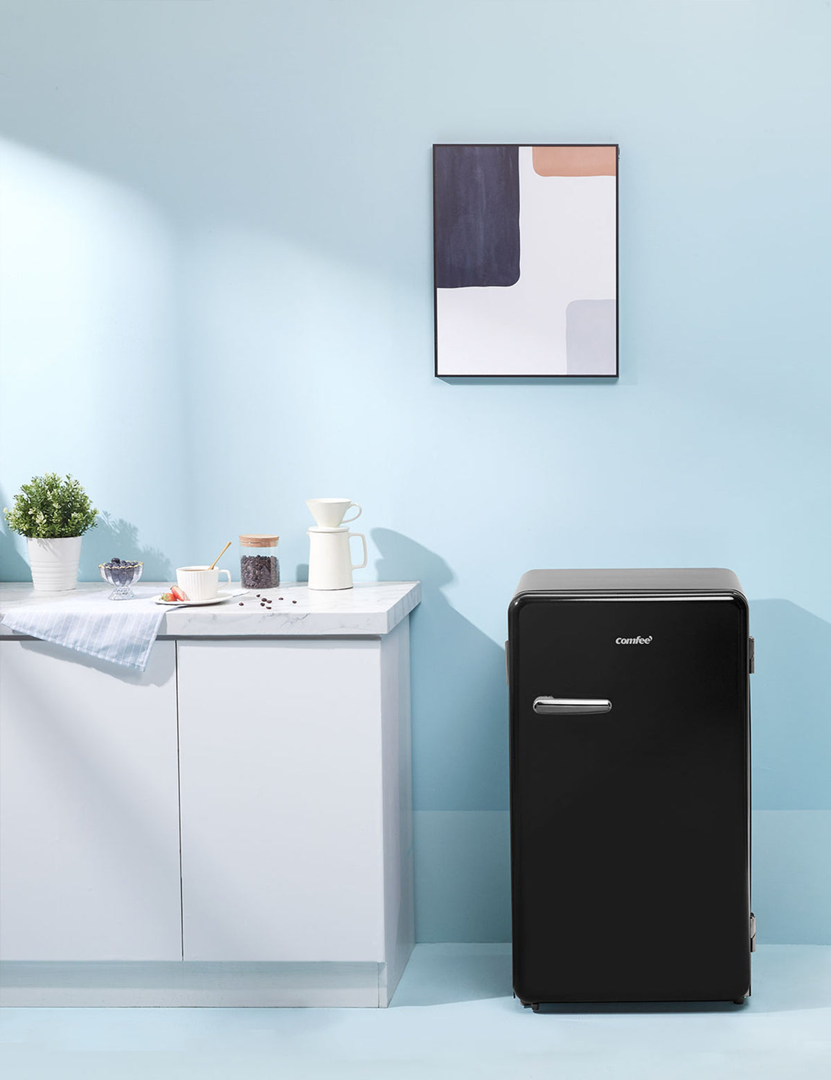 black compact refrigerator in a modern interior